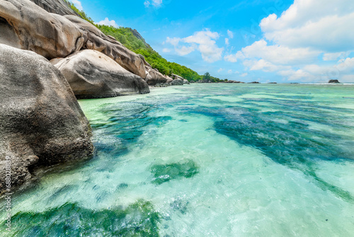 Granite rocks and coral reef in world famous Anse Source d'Argent beach