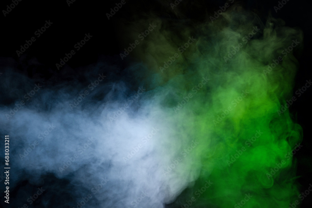 Fototapeta premium Green and white steam on a black background.