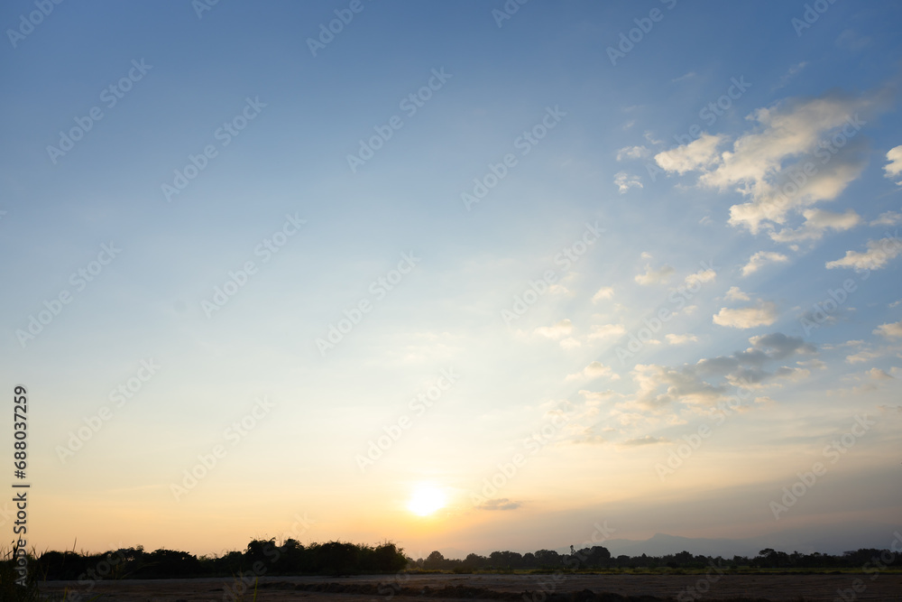 Beautiful sky and cloud at high. Landscape include space, light of nature, sunset, sunrise, horizon or skyline. Colorful with yellow, orange and blue at evening in autumn for background and wallpaper.