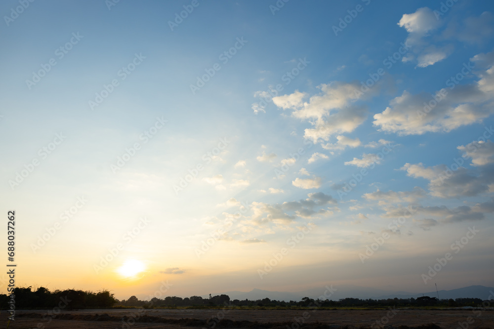 Beautiful sky and cloud at high. Landscape include space, light of nature, sunset, sunrise, horizon or skyline. Colorful with yellow, orange and blue at evening in autumn for background and wallpaper. Beautiful sky and cloud at high. Landscape include space, light of nature, sunset, sunrise, horizon or skyline. Colorful with yellow, orange and blue at evening in autumn for background and wallpaper.