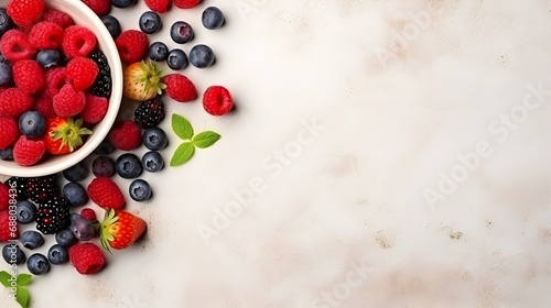 Fresh mixed berries on a white wooden background, space for text
