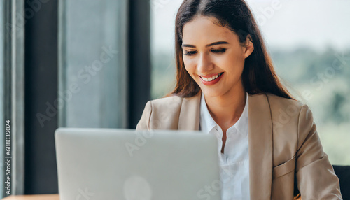businesswoman working on laptop © SA Studio