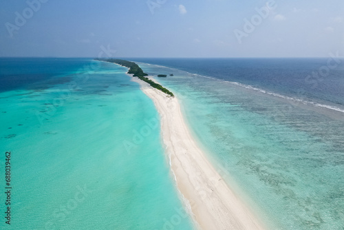 stunning blue ocean and sandy lux hotels on water top drone aeral view Maldives beach copyspace for text © yurakrasil