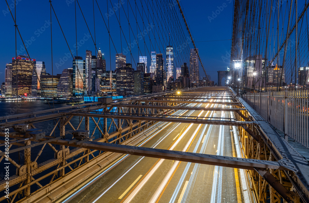Traffic lights on Brooklyn bridge at night with Manhattan skyscrapers on the background Traffic lights on Brooklyn bridge at night with Manhattan skyscrapers on the background