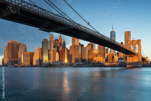 Classic view of Manhattan under Brooklyn Bridge at sunrise © Roberti