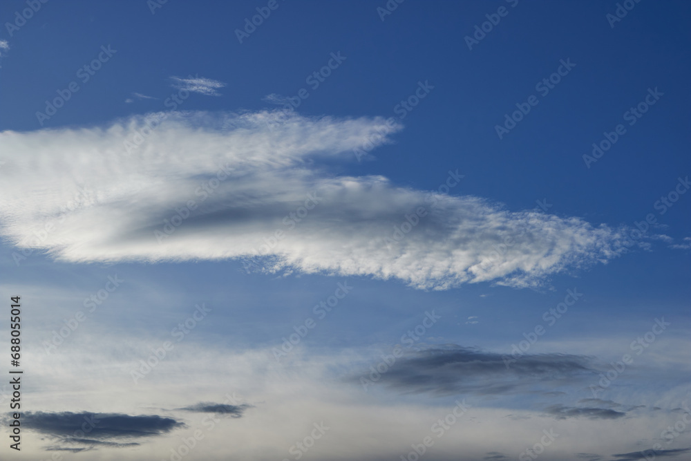 White and gray clouds with blue sky in the background, cirrocumulus.