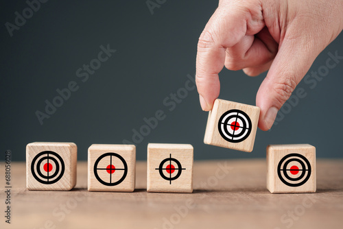 Hand pick the only target in a row, select, and narrow the target, customers, and audience, business marketing, and advertising concept