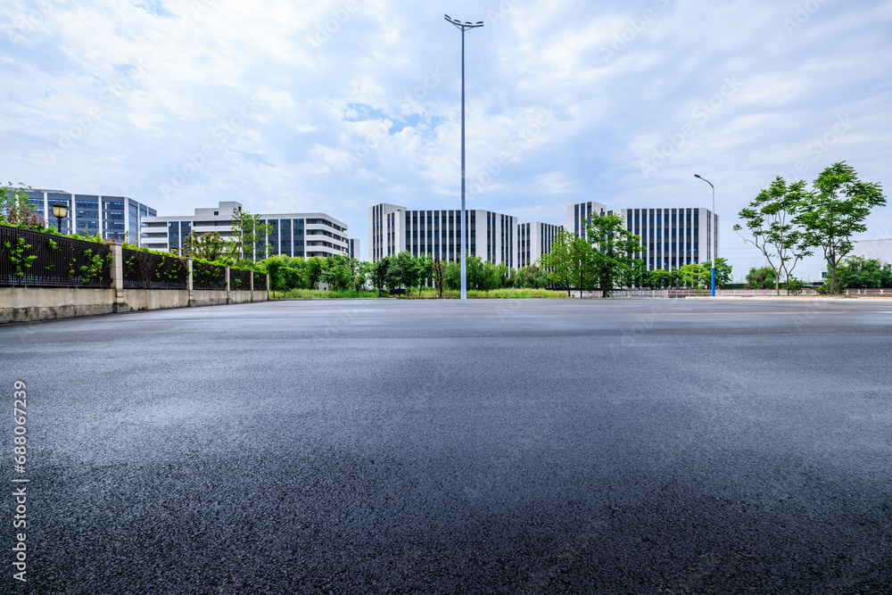Asphalt road square and factory building background