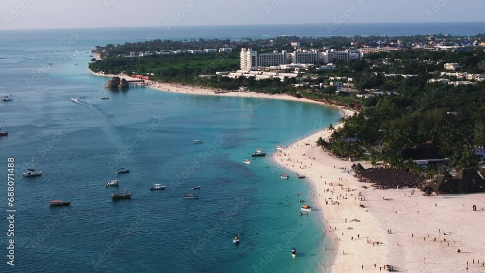 wonderful aerial shot of shoreline and turquoise ocean in zanzibar at sunny day, tanzania. wonderful aerial shot of shoreline and turquoise ocean in zanzibar at sunny day, tanzania.