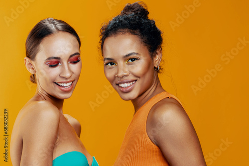 Two woman together happy beauty studio race colorful make-up model mixed skin