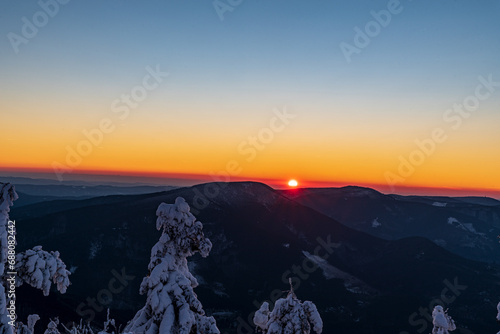 Sunset from Lysa hora hill in Moravskoslezske Beskydy mountains in Czech republic photo