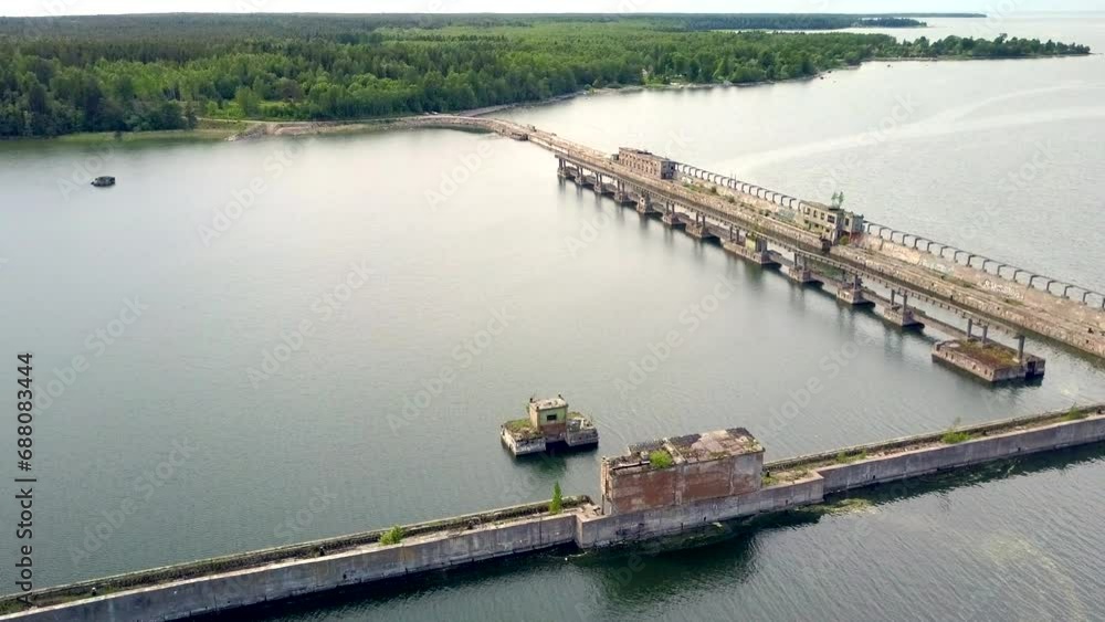 Estonia, Hara Bay-June 28, 2017: A very rare dilapidated naval base for demagnetization submarines during the Soviet era. High angle view. Camera slowly moves backwards. Estonia, Hara Bay-June 28, 2017: A very rare dilapidated naval base for demagnetization submarines during the Soviet era. High angle view. Camera slowly moves backwards.