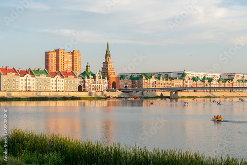 Yoshkar-Ola, Russia. Panorama of the city center. Malaya Kokshaga river, Bruges embankment, Theater bridge, Spasskaya tower photo