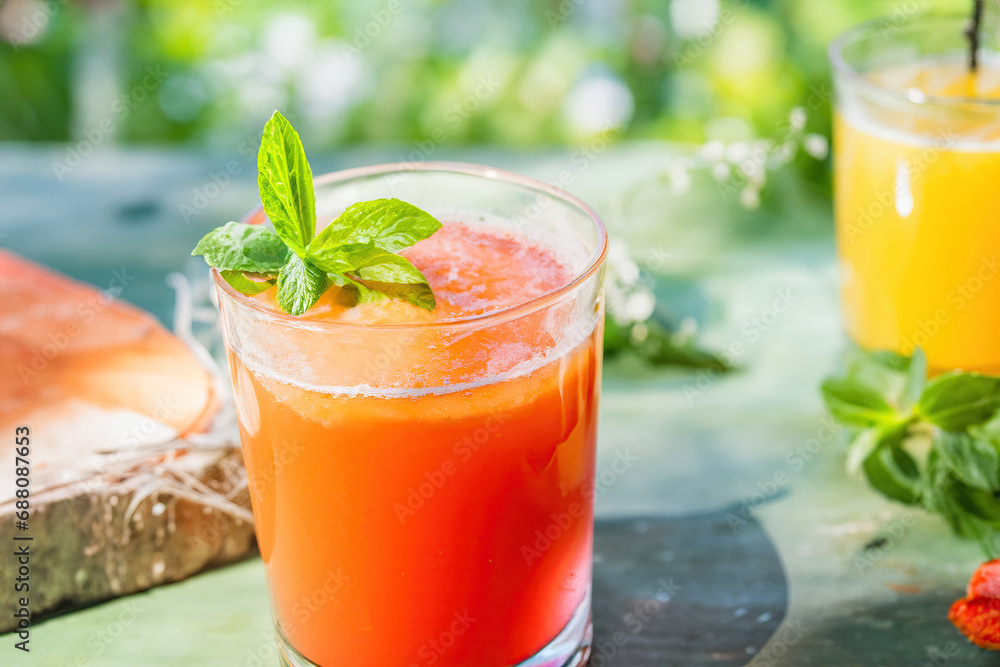 grapefruit juice with mint on summer background