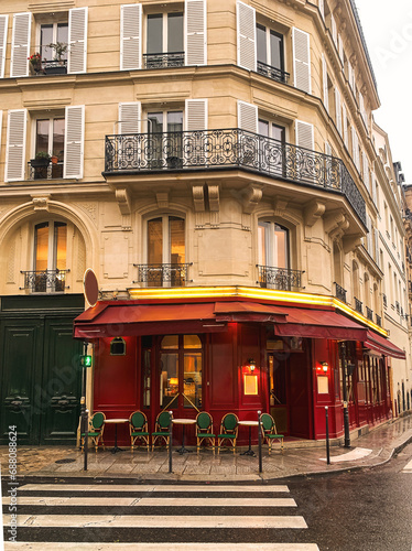 Typical Parisian cafe in the city center of Paris France with red facade 