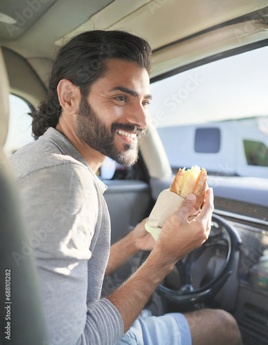 uomo che mangia panino su furgone al lavoro  photo