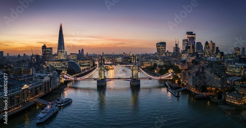 Panoramic aerial sunset view of the skyline of London, England, with Tower bridge and the City skyscrapers