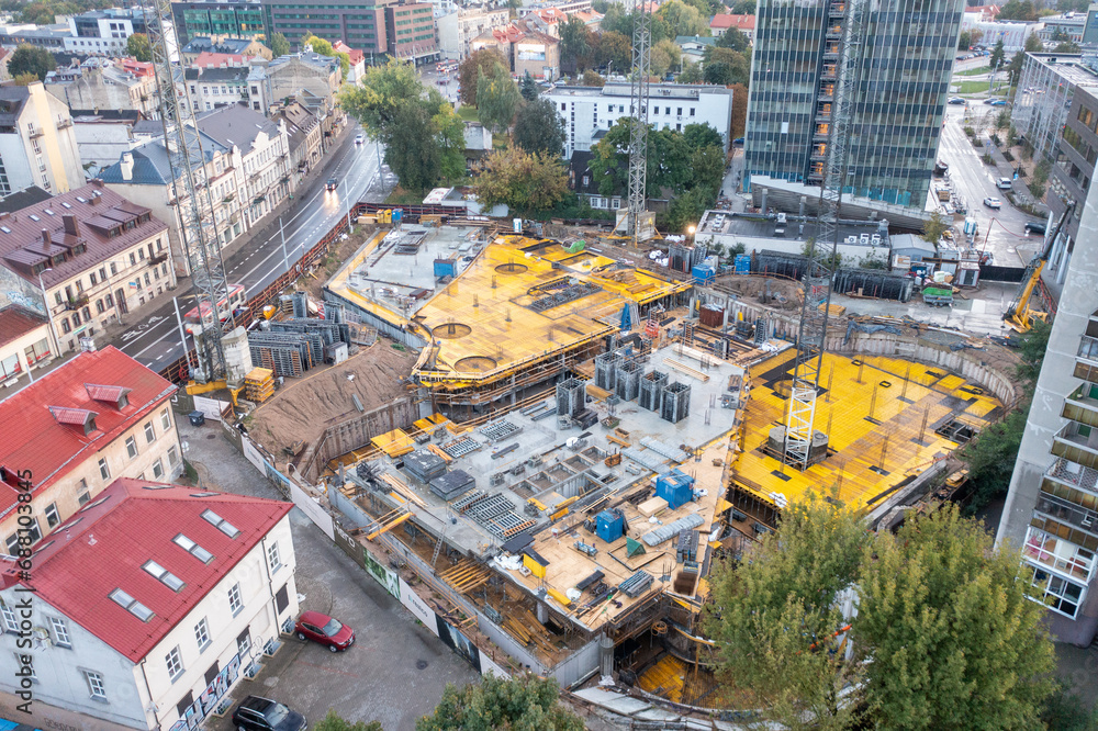 Drone photography of high rise building construction site in the middle of city