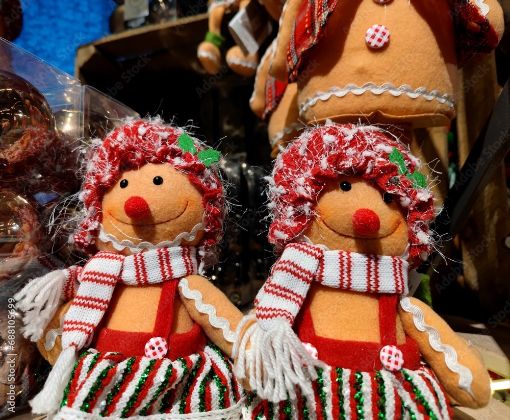 Christmas cuddly toys in the shape of Christmas cookies are being sold on shop shelves and are in a store during the Christmas period