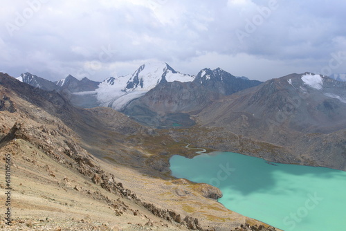 Ala-Köl lake from Ala-Kol mountain pass on seventh stage of Ak-Suu Traverse trek in Tian Shan mountains, Karakol, Kyrgyzstan