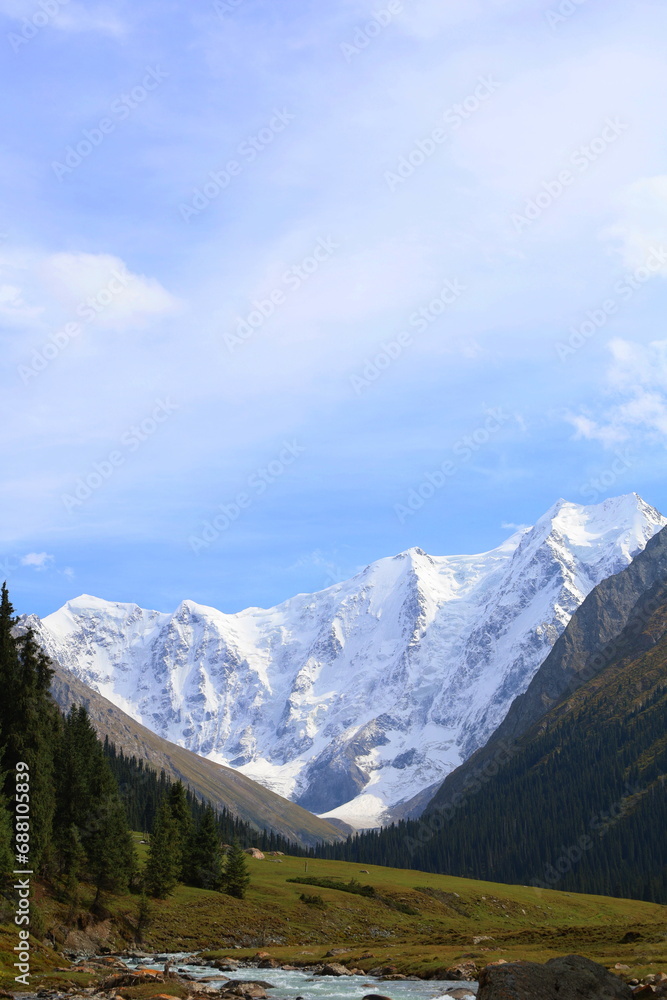 Obraz premium Tenth stage of Ak-Suu Traverse trek with a view of Karakol peak and Aylanish glacier in Kyrgyzstan