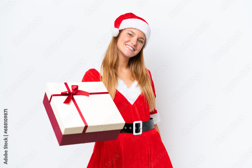 Young caucasian woman dressed as mama noel holding gift isolated on white background with happy expression Young caucasian woman dressed as mama noel holding gift isolated on white background with happy expression