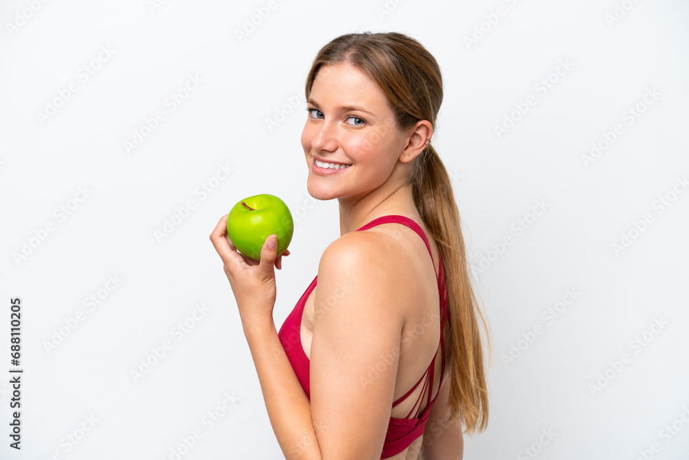 Young pretty blonde woman isolated on white background eating an apple Young pretty blonde woman isolated on white background eating an apple