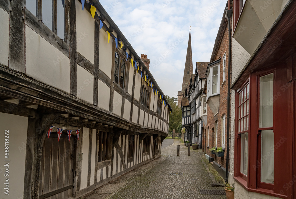 Cobbled street of Ledbury showing support with the colors of Ukraine