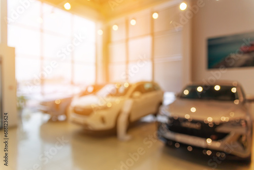 Blurred new car parked in modern showroom waiting for sales. © BY-_-BY