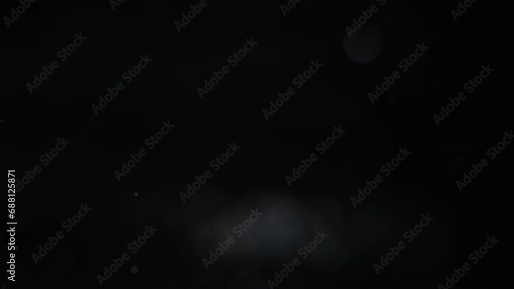 Explosion of silver sparkles. Chaotic abstract movement of silver shiny particles. Bokeh effect. Explosion of silver sparkles. Chaotic abstract movement of silver shiny particles. Bokeh effect.
