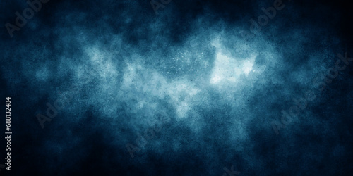 Blue color dust particles explosion cloud on black background. grunge dark blue textured stone wall background.  blue color paint texture.  dramatic smoke in the room - overlay for Photoshop.