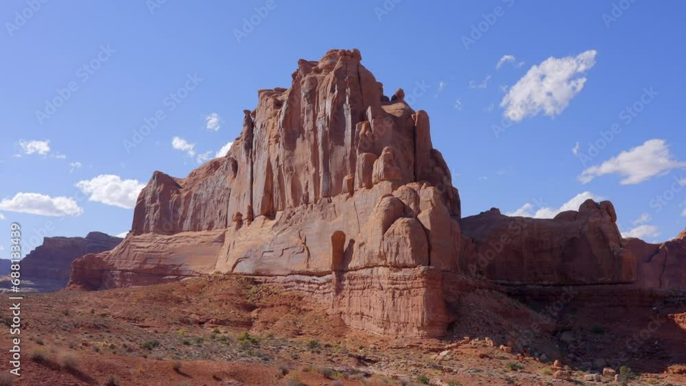 Establishing shot of mountain trail with red rocks background in La Sal Mountains, Arches National Park, Utah, North America. Day time on October 2023. Still camera view. ProRes 422 HQ. Establishing shot of mountain trail with red rocks background in La Sal Mountains, Arches National Park, Utah, North America. Day time on October 2023. Still camera view. ProRes 422 HQ.