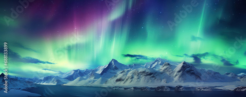 Majestic aurora borealis illuminating a mountain range © Yeti Studio