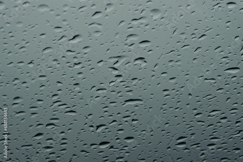a wet car window with raindrops