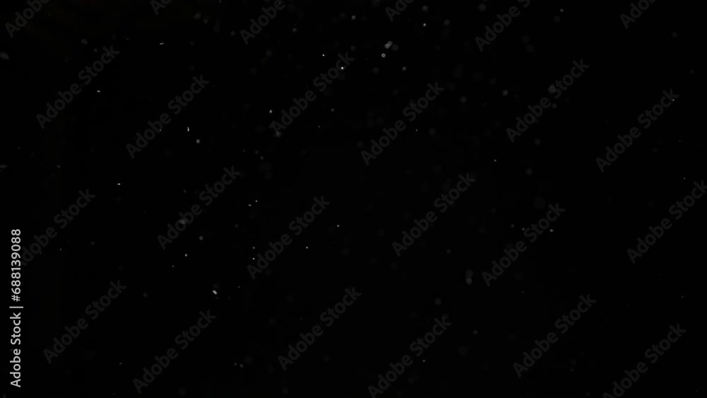 Dust particles on black background. Abstract dust particles with white light bokeh, snow glare and flare sparkles Dust particles on black background. Abstract dust particles with white light bokeh, snow glare and flare sparkles