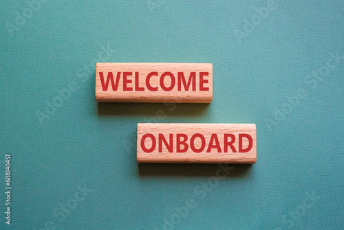 Welcome onboard symbol. Concept words Welcome onboard on wooden blocks. Beautiful grey green background. Business and Welcome onboard concept. Copy space.