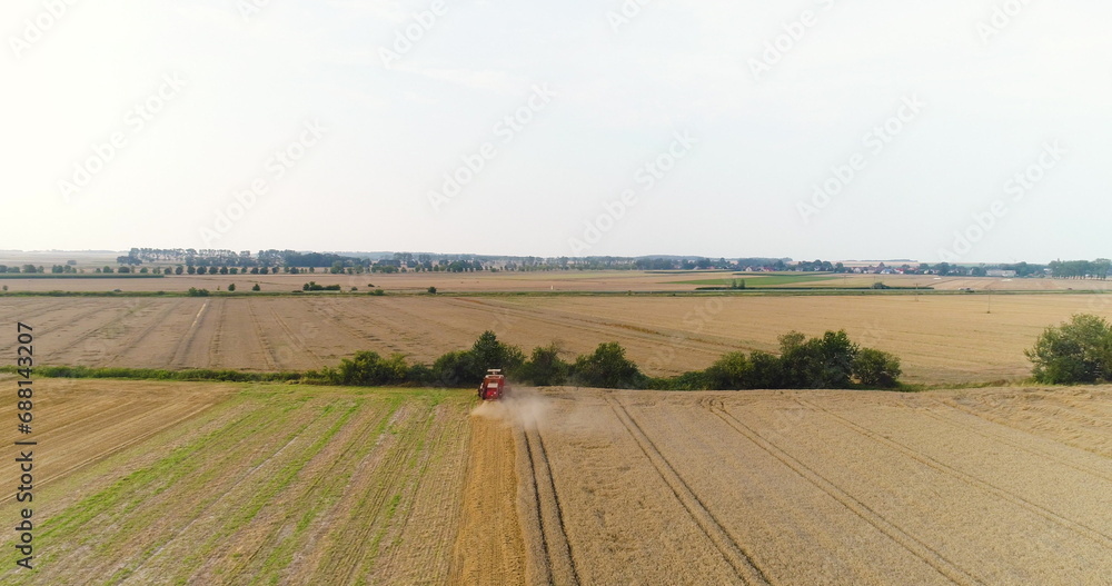 combine harvester harvesting wheat field agriculture