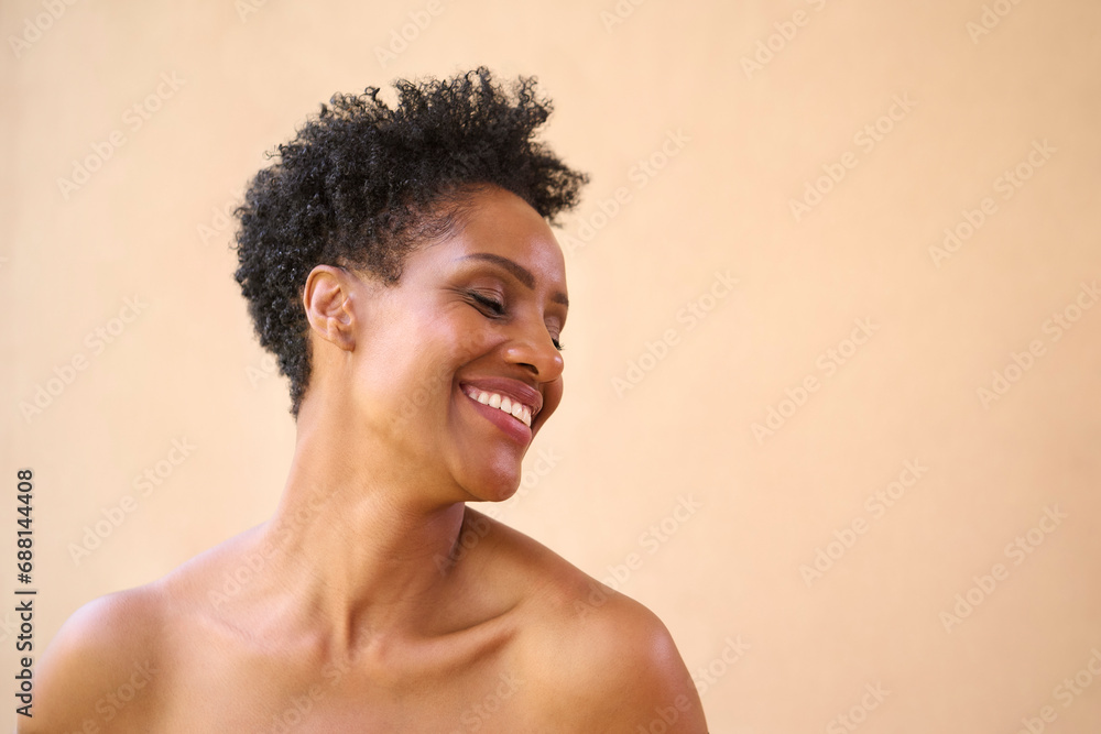 Beauty Portrait Of Smiling Mature Woman With Bare Shoulders Against Natural Background Beauty Portrait Of Smiling Mature Woman With Bare Shoulders Against Natural Background