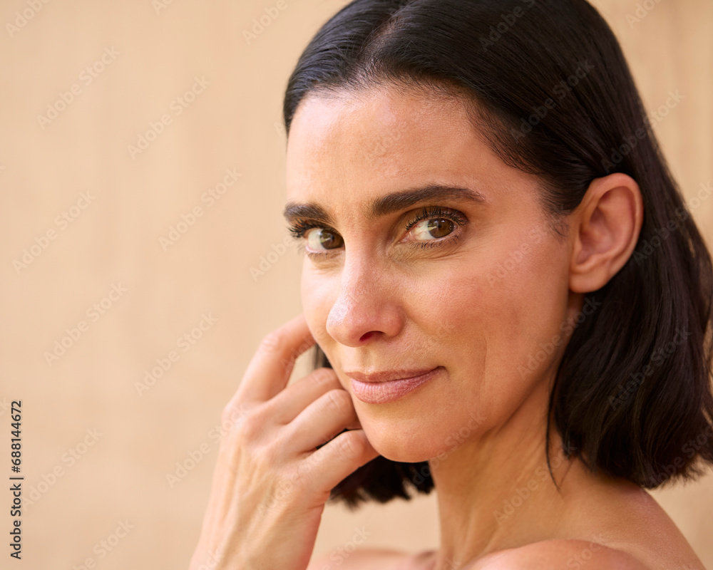 Beauty Portrait Of Smiling Mature Woman With Bare Shoulders Against Natural Background Beauty Portrait Of Smiling Mature Woman With Bare Shoulders Against Natural Background