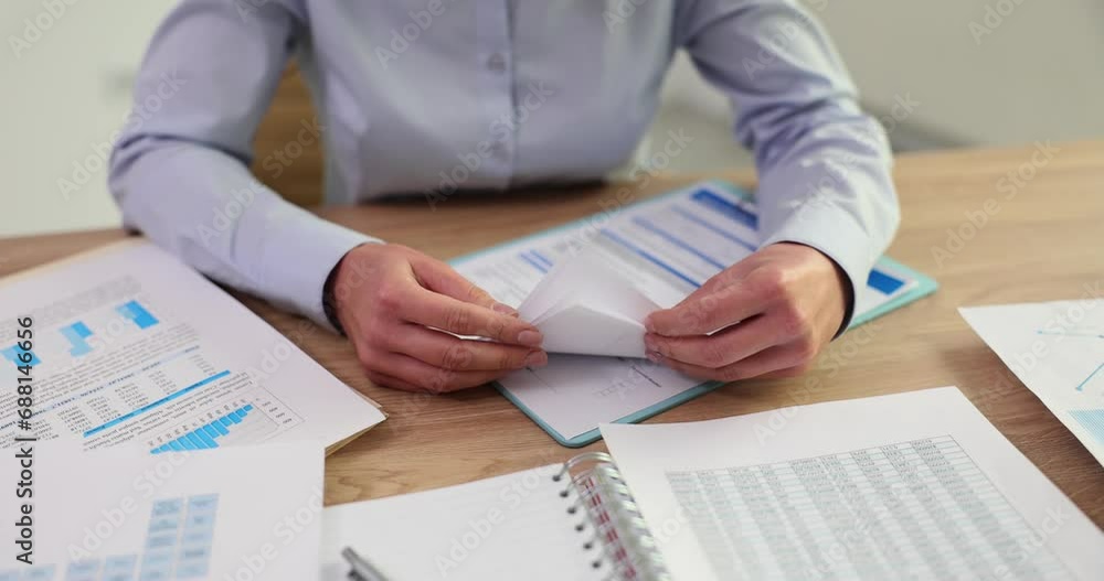 Woman corporate employee shows client number of pages Woman corporate employee shows client number of pages
