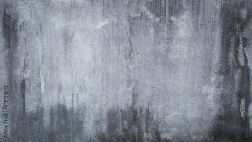 A gray grunge picturesque wall texture with stains and scratches on concrete surface 