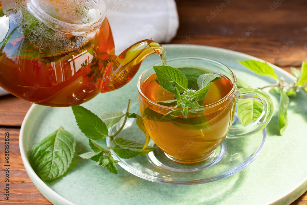 Green tea with mint in a transparent bowl. Healthy food, antioxidants. Green tea with mint in a transparent bowl. Healthy food, antioxidants.