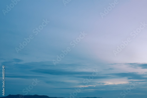 Peaceful romantic sky with soft pastel clouds surrounded by cozy picturesque environment 