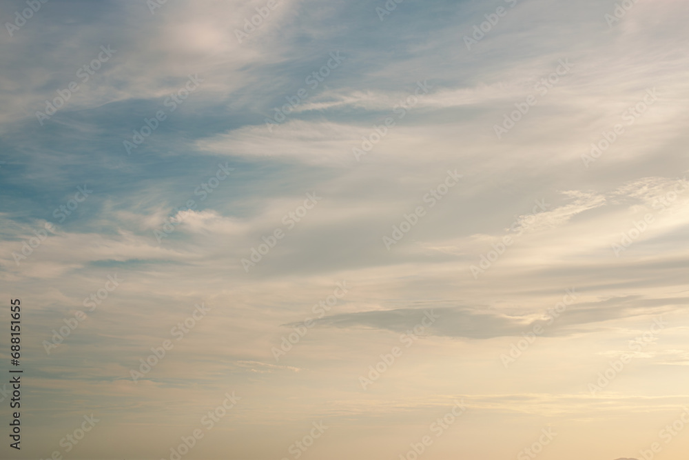 Peaceful warm sky with soft spindrift clouds surrounded by cozy environment 