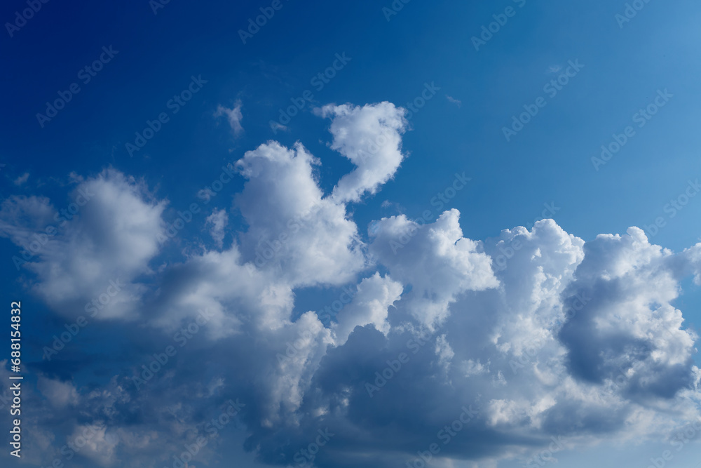 Cumulus clouds in the blue sky close-up, among the clouds Cumulus clouds in the blue sky close-up, among the clouds