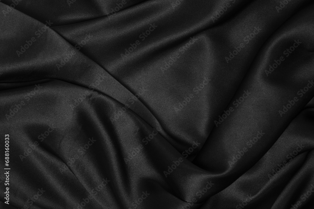 Part of the dark fabric texture of the fabric for the background and decoration of the work of art, a beautiful crumpled pattern of silk or linen. A crumpled piece of cloth Part of the dark fabric texture of the fabric for the background and decoration of the work of art, a beautiful crumpled pattern of silk or linen. A crumpled piece of cloth