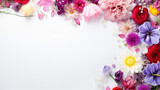Mockup. Brightly colored flowers on white background. Top view. Copy space. Pink, purple, pastel colours. 