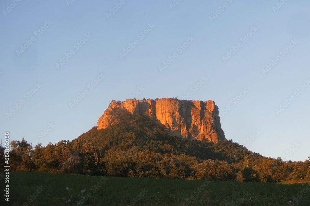 isolated rock in the heart of Italy in the Emilia Romagna region called PIETRA DI BSIMANTOVA at sunset