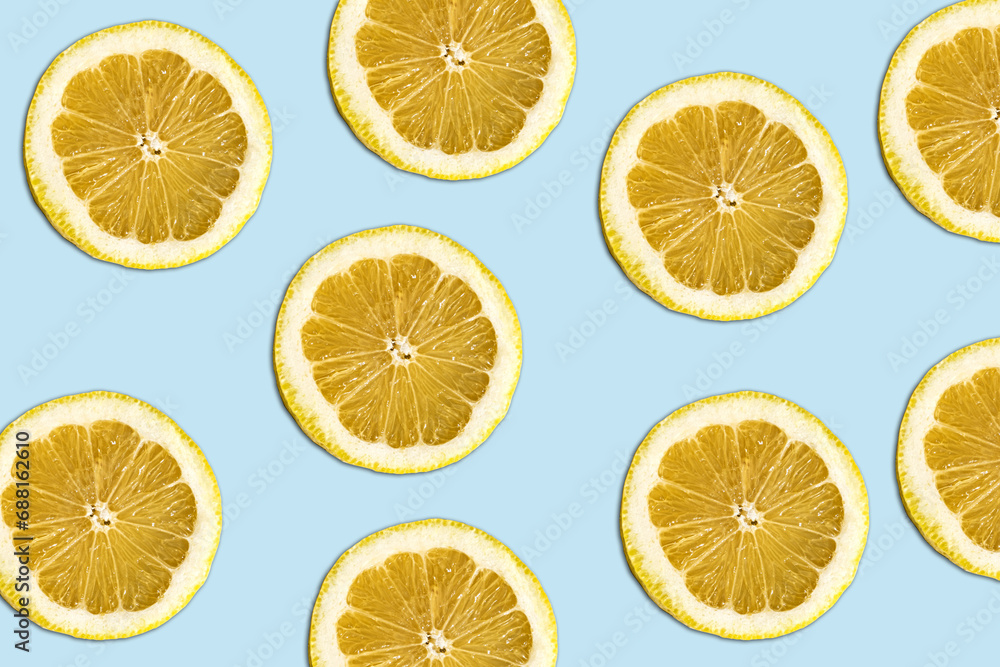lemmon pattern on bright light blue background. Minimal flat lay food texture. Summer abstract trendy fresh concept.