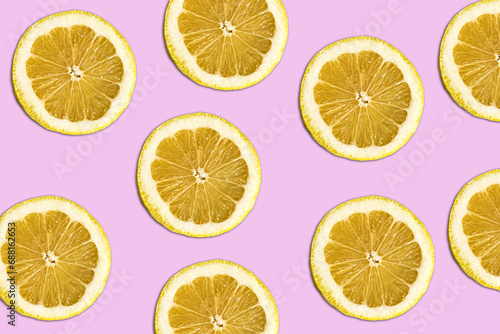 lemmon pattern on bright pink background. Minimal flat lay food texture. Summer abstract trendy fresh concept.